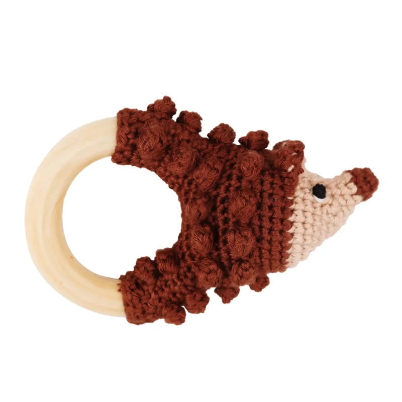 Hedgehog HARRY rattle ring with crocheted yarn surface and untreated beechwood ring, front view isolated