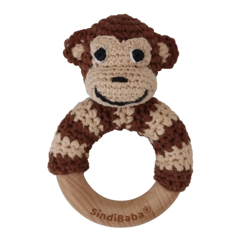 12602-ring-rattle-monkey-front Monkey ring rattle with crocheted yarn surface and untreated beechwood ring, front view isolated
